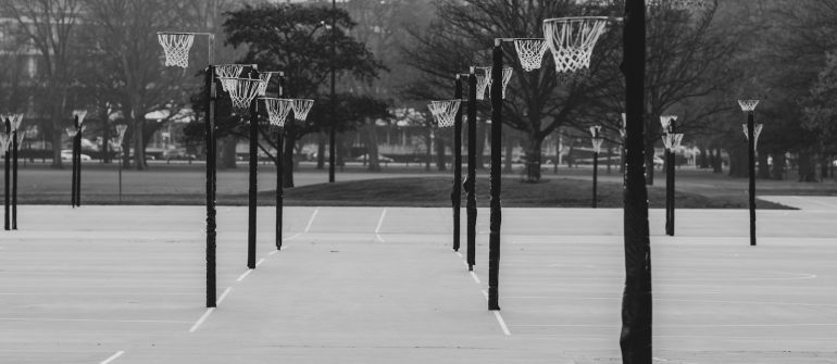 a black and white photo of a basketball court